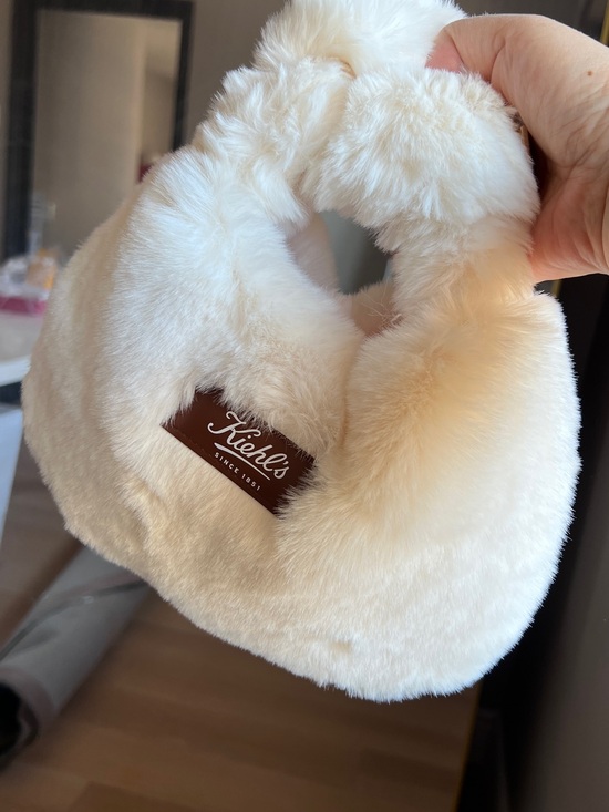 Kiehl's Handbags - New! Kiehl's Cream Faux Fur Clutch with Brown Logo Patch